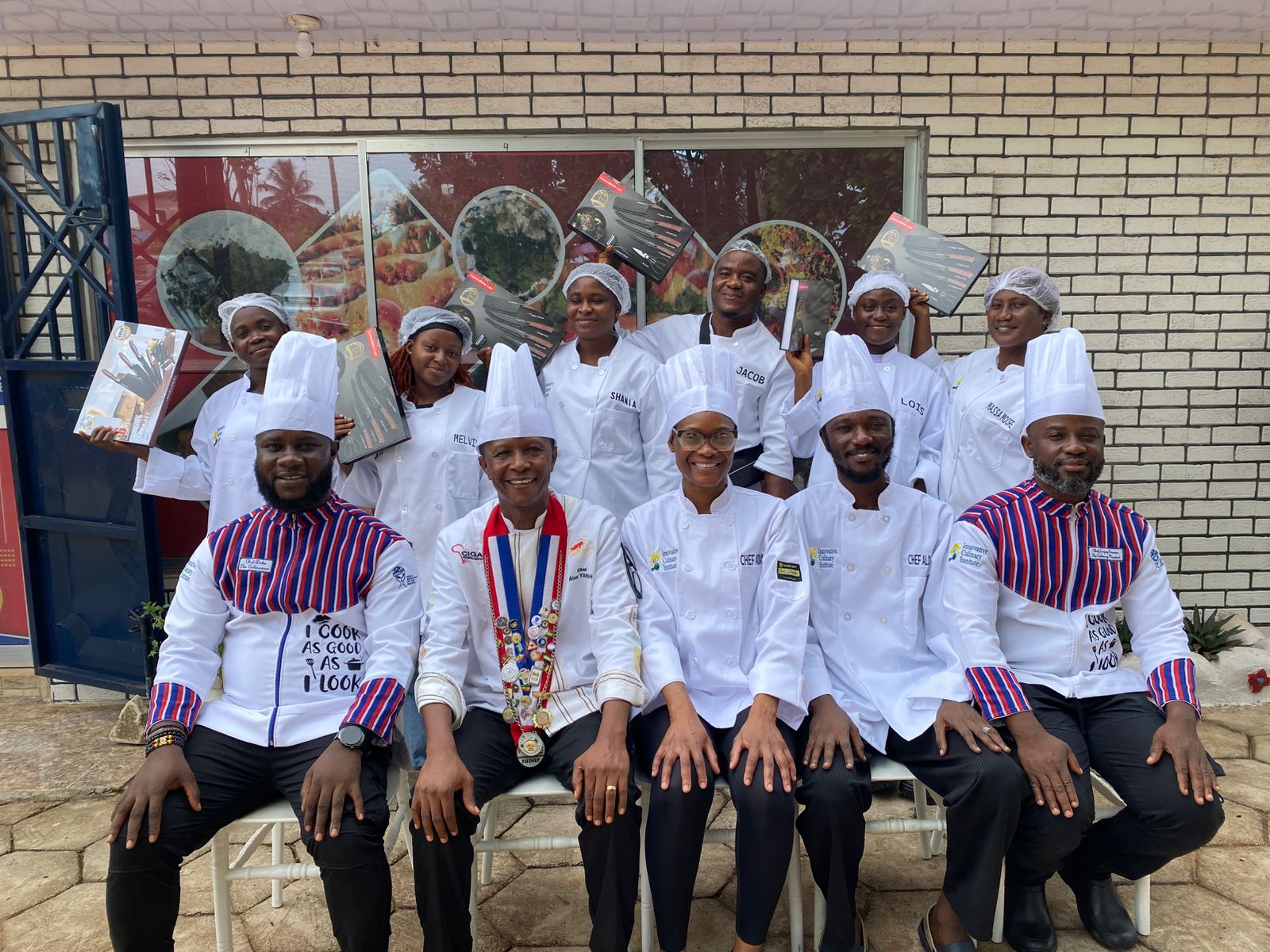 Workshop participants and chef instructors with their knife sets